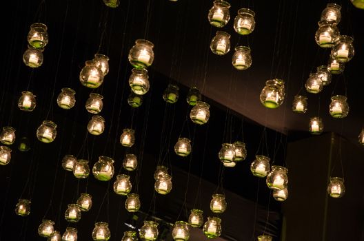 floating candles moored to a tree