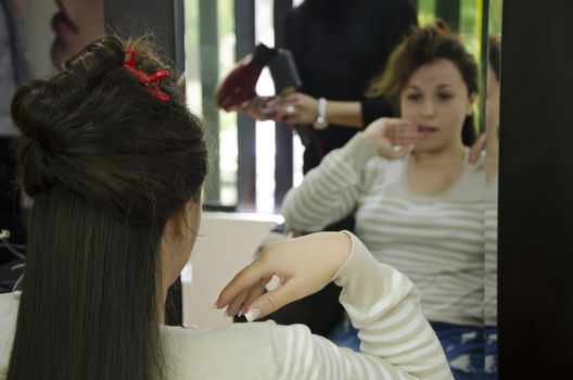 Woman in a hairdresser doing a hairstyle