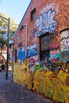 Melbourne, Australia - June 12, 2020: Street art and graffiti, famous in Melbourne, is seen in Fitzroy area near Brunswick St