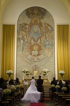 Bride and groom at the altar of a church