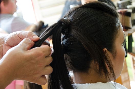 Woman in a hairdresser doing a hairstyle