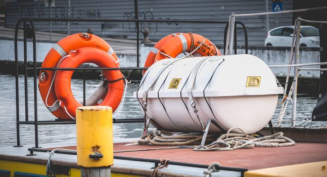 Aveiro, Portugal - May 7, 2018: Lifeboat on a Tourist Boat Transport docked at the end of the day on a spring day