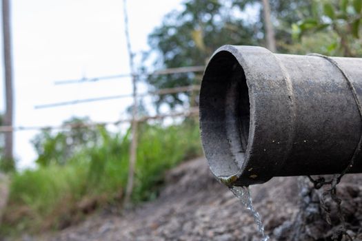 The cement drainage pipes allow waste water to flow through. Behind industrial plants After the production process