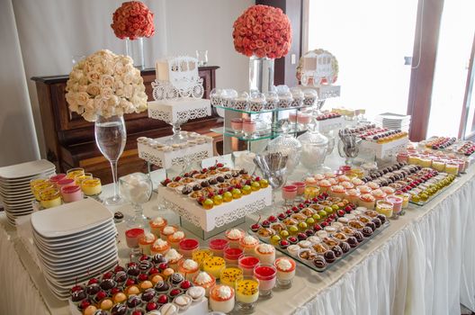 Decorating a candy table at a wedding