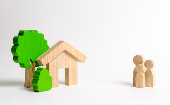 Figures of the family and house on a white background. real estate, your own home. Affordable housing on credit or mortgage. Renovation and construction. Subsidies, citizenship. Buying or selling.