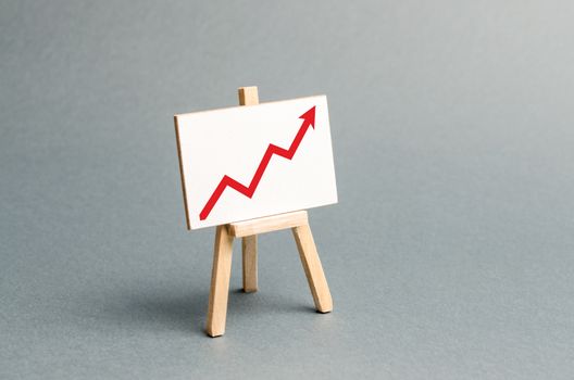 Rack with a red arrow up. Business planning and revenue analysis. Indicators of business projects, level of profitability, liquidity. Increase efficiency, productivity. Selective focus