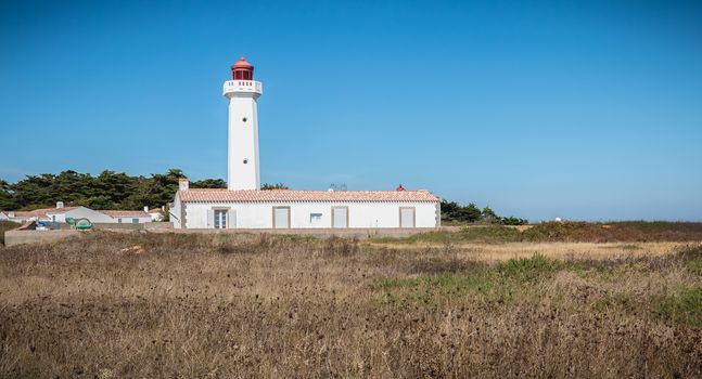 Port Joinville, France - September 17, 2018 - Architectural detail of the Corbeaux Marine Lighthouse on a summer day