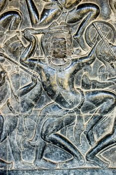 Bas relief sculpture of a Kaurava soldier fighting in the Battle of Kurukshetra against the Pandava, as descried in the Mahabharata. West gallery, southern section, Angkor Wat, Cambodia.