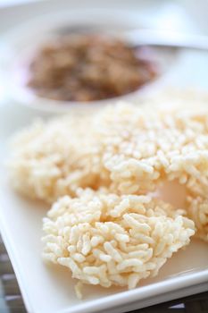 Thai food rice crust with pork white sauce