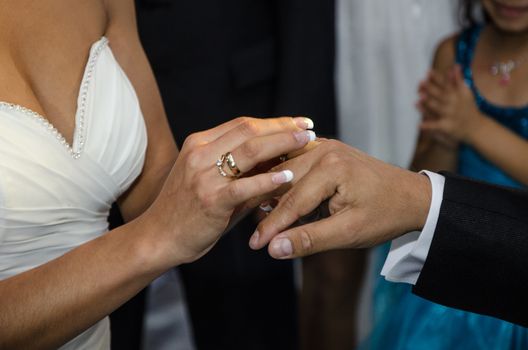 Exchange rings between the bride and groom