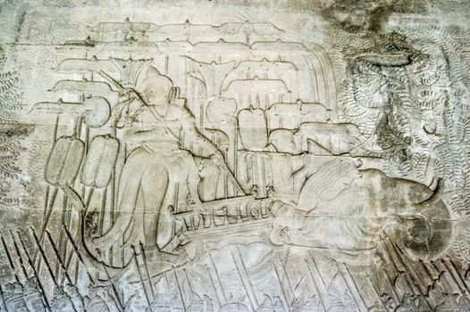 The twelfth century Cambodian ruler King Suryavaman II commanding a battle from the back of an elephant. Khmer bas relief at Angkor Wat temple, Siem Reap, Cambodia.
