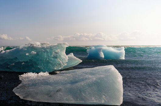 Icebergs lying on the Diamond Beach located in Jokulsarlon Glacier Lagoon in Iceland.