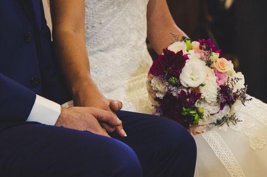 Bride and groom holding hands before getting married