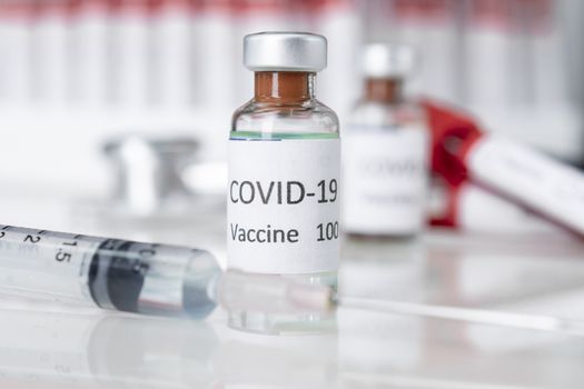 Nobel coronavirus covid-19 vaccine vial a illustrative picture, doctor in the laboratory with a biological tube for analysis and sampling of Covid-19 infectious disea.