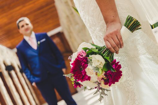 Bride teaching bouquet to her future husband