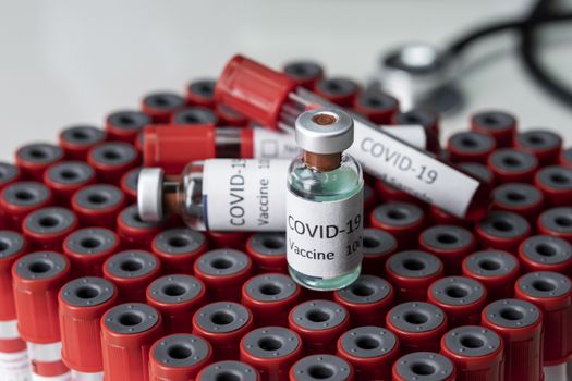 Nobel coronavirus covid-19 vaccine vial a illustrative picture, doctor in the laboratory with a biological tube for analysis and sampling of Covid-19 infectious disea.