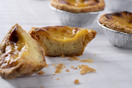 Egg tart, traditional Portuguese dessert, pasteis de Nata Portuguese Custard Tarts food on a Cooling Rack. Typical custard pies.