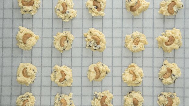 Directly Above Shot Of Chocolate Chip Cookies On Cooling Rack At Table, Preparing chocolate chip cookies