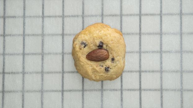 Directly Above Shot Of Chocolate Chip Cookies On Cooling Rack At Table, Preparing chocolate chip cookies