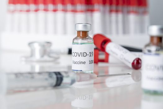 Nobel coronavirus covid-19 vaccine vial a illustrative picture, doctor in the laboratory with a biological tube for analysis and sampling of Covid-19 infectious disea.