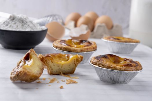 Egg tart, traditional Portuguese dessert, pasteis de Nata Portuguese Custard Tarts food on a Cooling Rack. Typical custard pies.