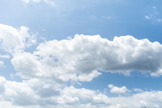 Blue sky background with clouds, The cumulus level cloud level is 8,000-20,000 feet beautiful by nature, white fluffy clouds In sunny summer.