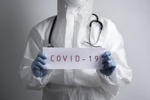 A doctor with a paper with stay at home holding on hand, protect from Coronavirus or Covid-19 epidemic