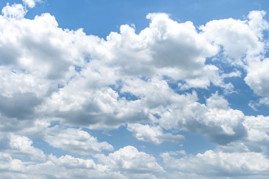 Blue sky background with clouds, The cumulus level cloud level is 8,000-20,000 feet beautiful by nature, white fluffy clouds In sunny summer.