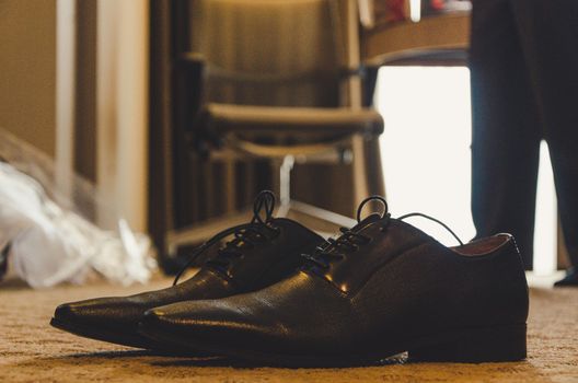 Groom shoes on his wedding day