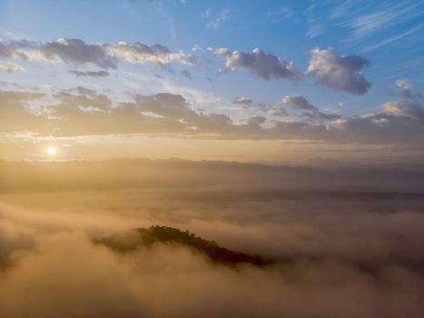 Aerial view forest in morning fog mist, breathing mountains, Sunshine on The Morning Mist.