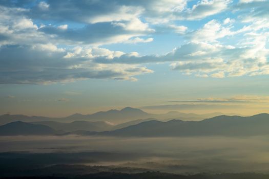 Mountain with white mist in morning sunrise, nature landscape. Beautiful mountain with white mist in morning sunrise, nature landscape.