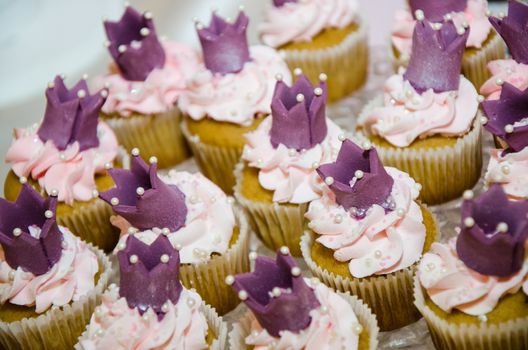 Cupcake with crown and cream of cake