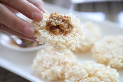 Thai food rice crust with pork spicy sauce