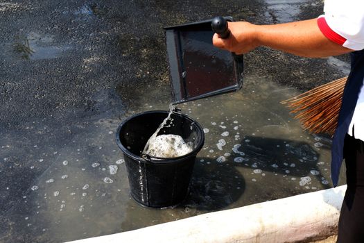 people are sweeping dirty water at ground streets, cleaner floor, housemaid, housekeeper, homemaker, maidservant, maid