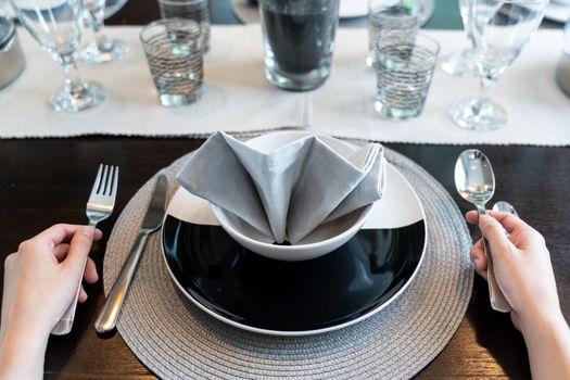 Female hands with empty plate For Meal Waiting