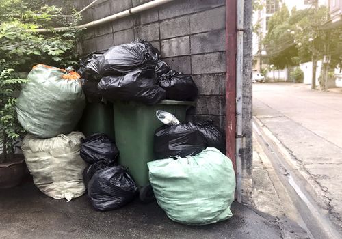 garbage is pile lots dump, many garbage plastic bags black waste at walkway community village, pollution from trash plastic waste garbage, bags bin of plastic waste, pile garbage waste, lots junk dump