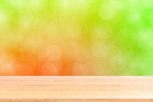 empty wood table floors on blurred bokeh soft red green gradient background, wooden plank empty on green bokeh colorful light shade, colorful bokeh lights gradient soft for banner advertising products