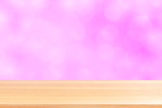 empty wood table floors on blurred bokeh soft pink gradient background, wooden plank empty on pink bokeh colorful light shade, colorful bokeh lights gradient soft for banner advertising products