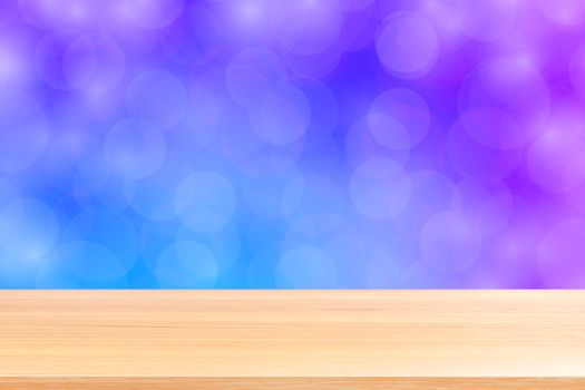 empty wood table floor on blurred bokeh soft purple gradient background, wooden plank empty on purple bokeh colorful light shade, colorful bokeh lights gradient soft for banner advertising products