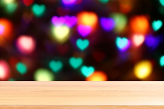 wood plank on lighting colorful heart shaped bokeh black background, empty wood table floors on heart shape bokeh night light multi color background, wood table board empty on bokeh heart shape light