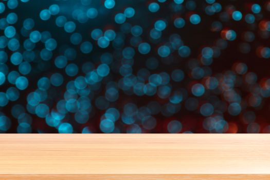 wood plank on abstract blurred blue red silver glittering shine bulbs lights background, empty wood table floors on Bokeh Blur dot light xmas, wood table board empty front sparkle circle lit display