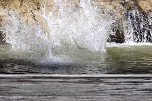 wood plank on water splash of waterfall nature fresh background, empty wood table floors on splash water in forest waterfall, wood table board empty on water splash water nature
