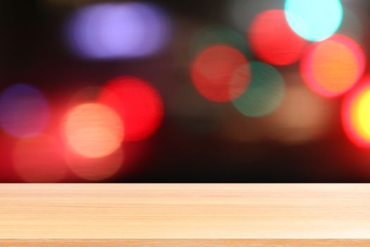 wood plank on colorful bokeh light abstract background, empty wood table floors on abstract bokeh night light multi color background, wood table board empty front colorful bokeh multi color beam light