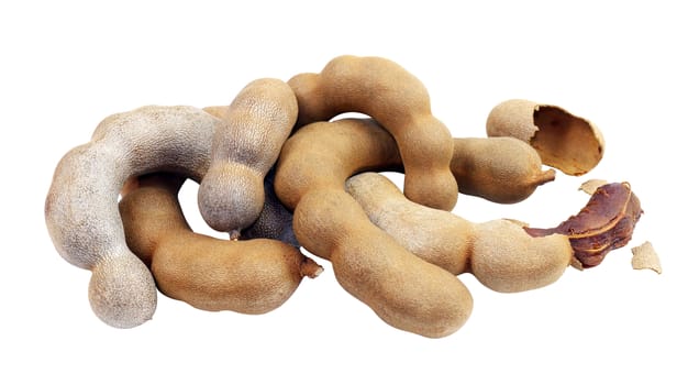 tamarind, sweet tamarind, brown tamarind pile, tamarind heap isolated on white background