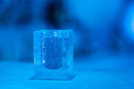 Cocktail short glass made of ice. In Igloo ice bar in winter season.