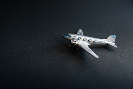 Mid-twentieth century civil aviation aircraft in miniature on black background