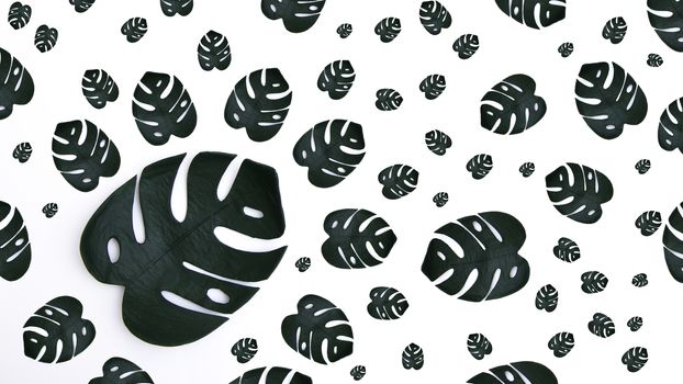 Pattern many tropical monstera on a white background