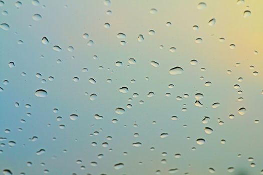 water rain drop on soft blue nature glass for abstract fresh background