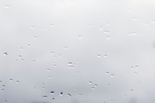 Blurred background water rain drops on glass windows, White Background rain cold