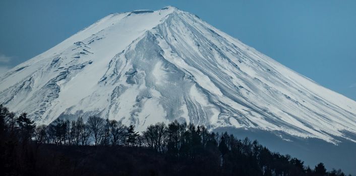 Close up top of Fuji mountain with snow cover on the top with could, fujisan